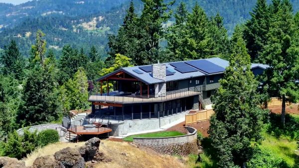 A hilltop home with solar panels on the roof