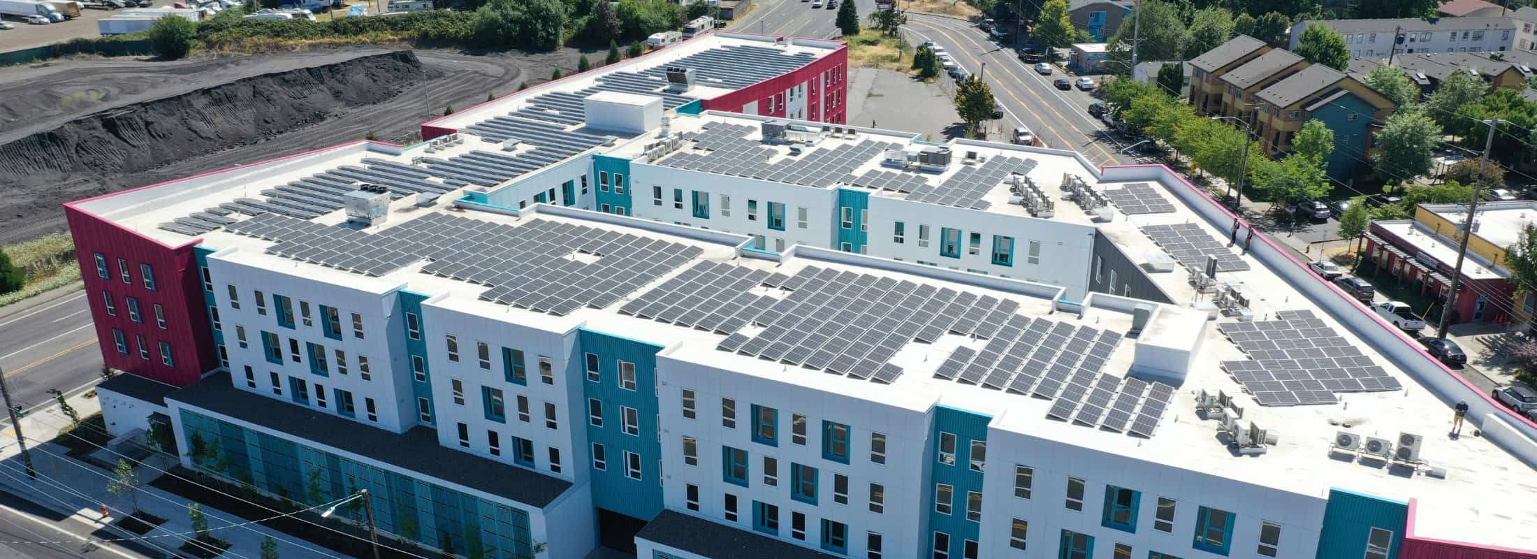 A large apartment building in Portland, Oregon with a solar energy system from Neil Kelly Solar