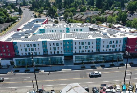 Aerial view of solar panels on top of Las Adelitas in NE Portland.